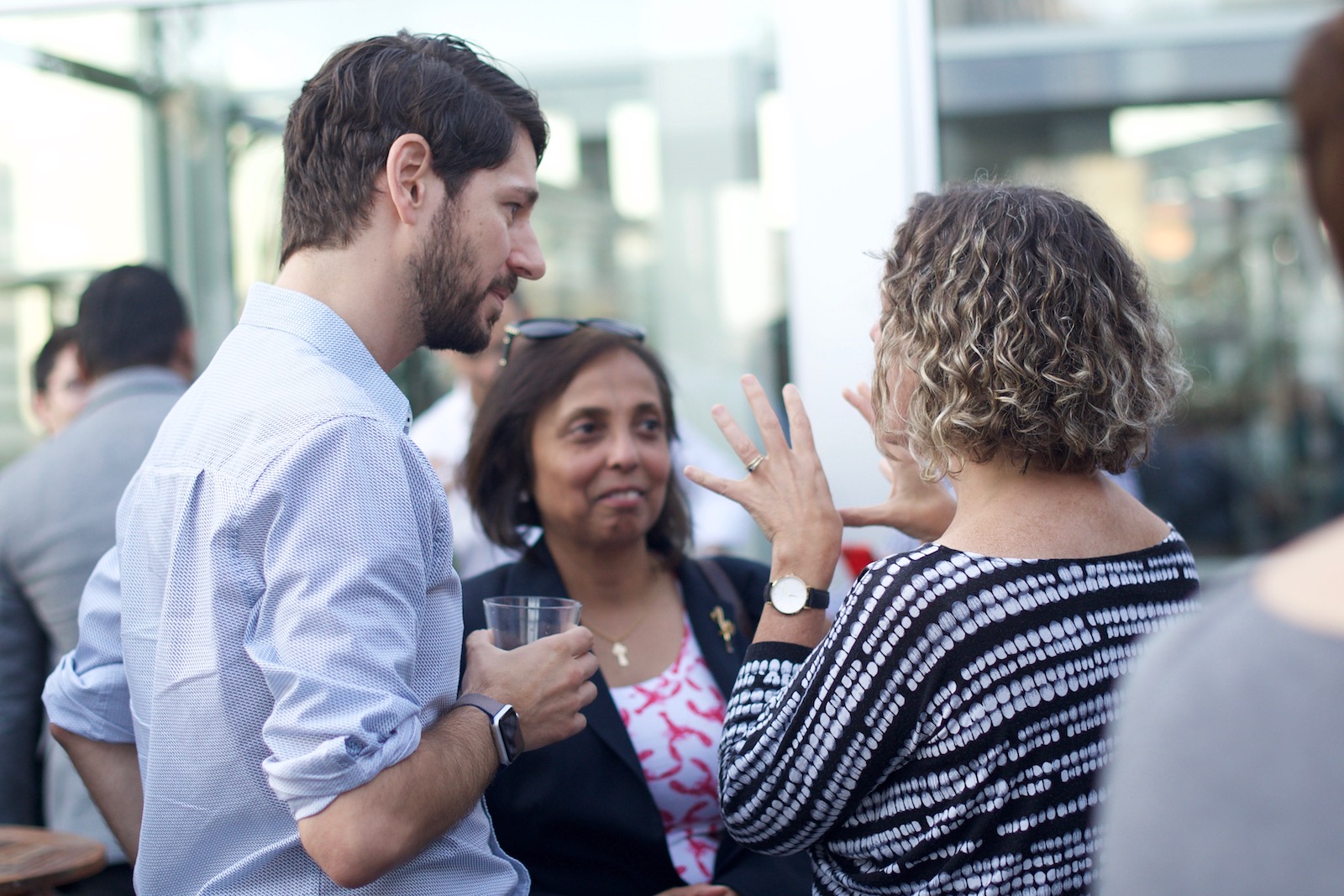 Talking in groups at the ask-an-expert mix and mingle.