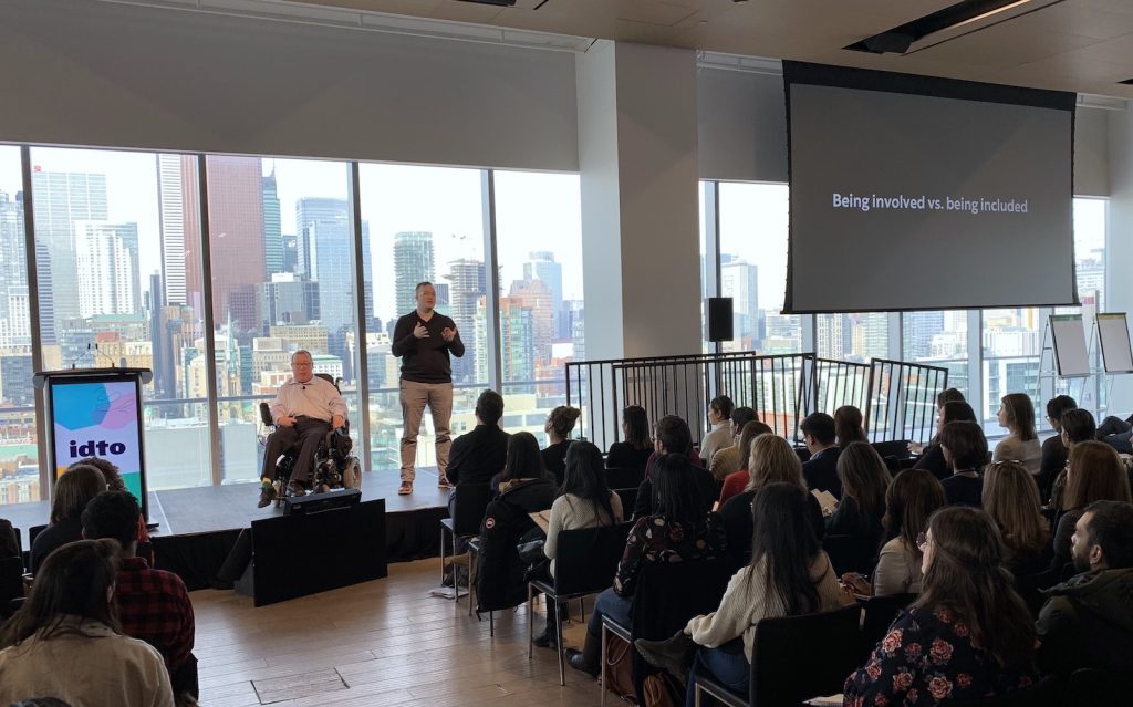 David Dame speaks alongside an ASL translator at IDTO